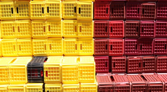 Yellow and red crates are stacked at the Boekenhoutskloof winery in Franschhoek, South Africa.