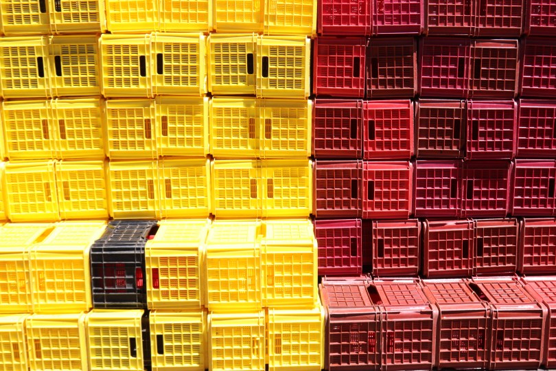 Yellow and red crates are stacked at the Boekenhoutskloof winery in Franschhoek, South Africa.