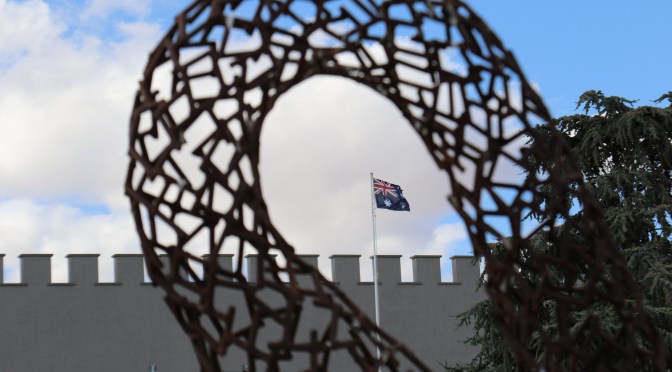 The Australian flag shot through a sculpture at Taylors Wines in the Clare Valley Australia.