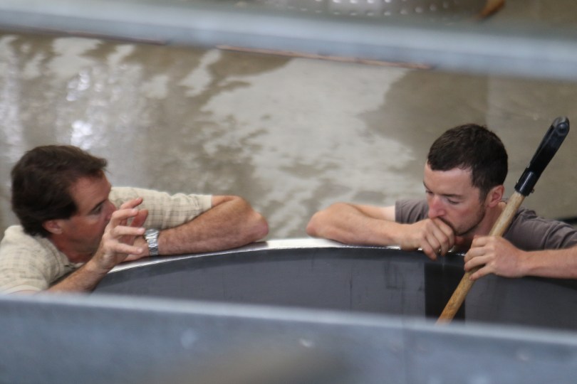 Winemaker Blair Walter discusses the fermenting grapes at the Felton Road winery in New Zealand.
