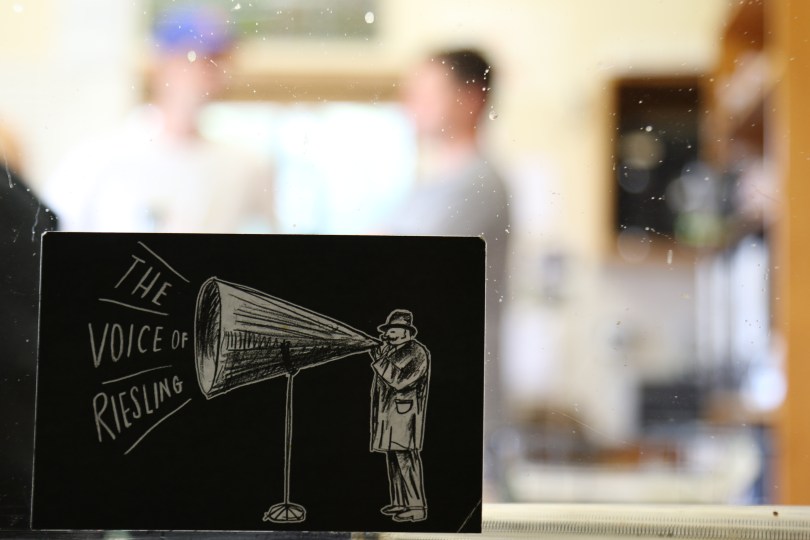 A voice of Riesling postcard sits in the window of the Greystone Wines lab in New Zealand.