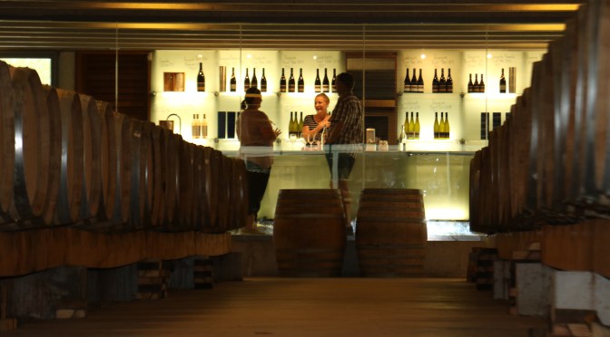 Having fun tasting wine at the Peregrine Wines cellar door in New Zealand.