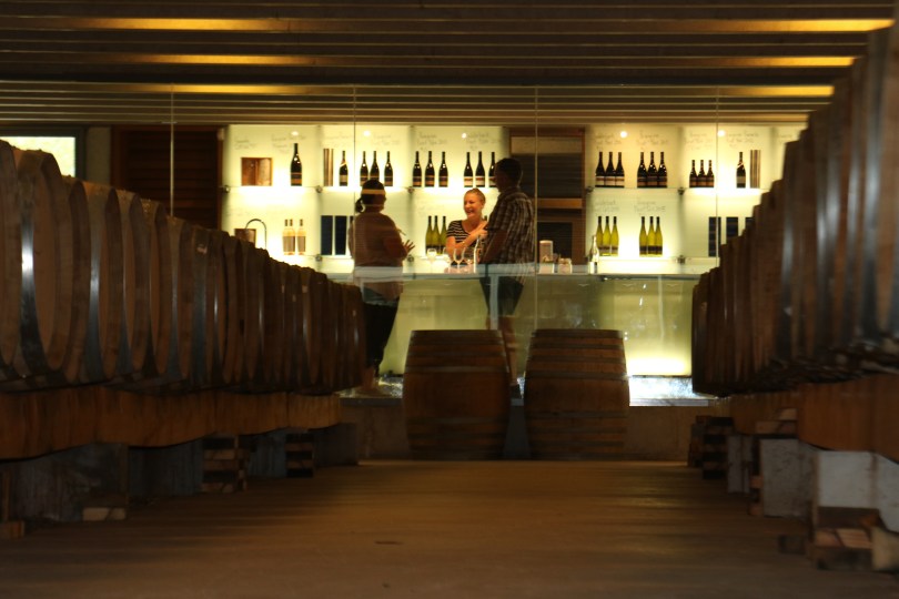 Having fun tasting wine at the Peregrine Wines cellar door in New Zealand.