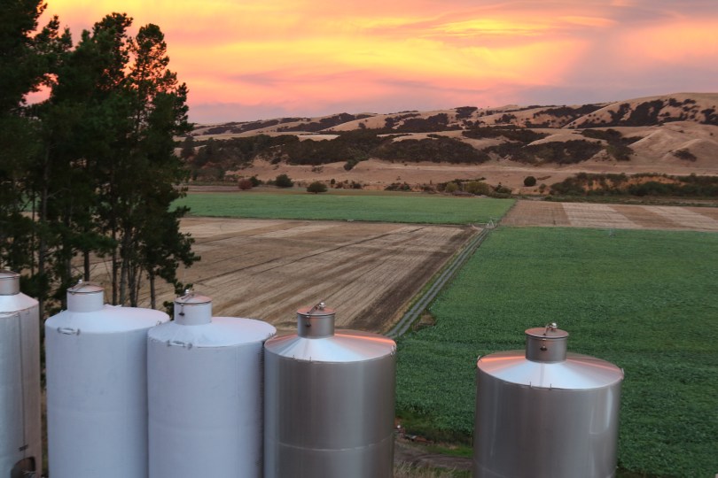 Escarpment tanks with a beautiful sky as the sun sets in Martinborough New Zealand.