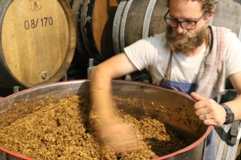 Stirring the ferment at Millton Organic Vineyards in Gisborne New Zealand.